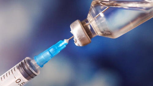 A syringe being filled with KISIMA (ATP150/ATP152 and VSV-GP154) cancer vaccine.